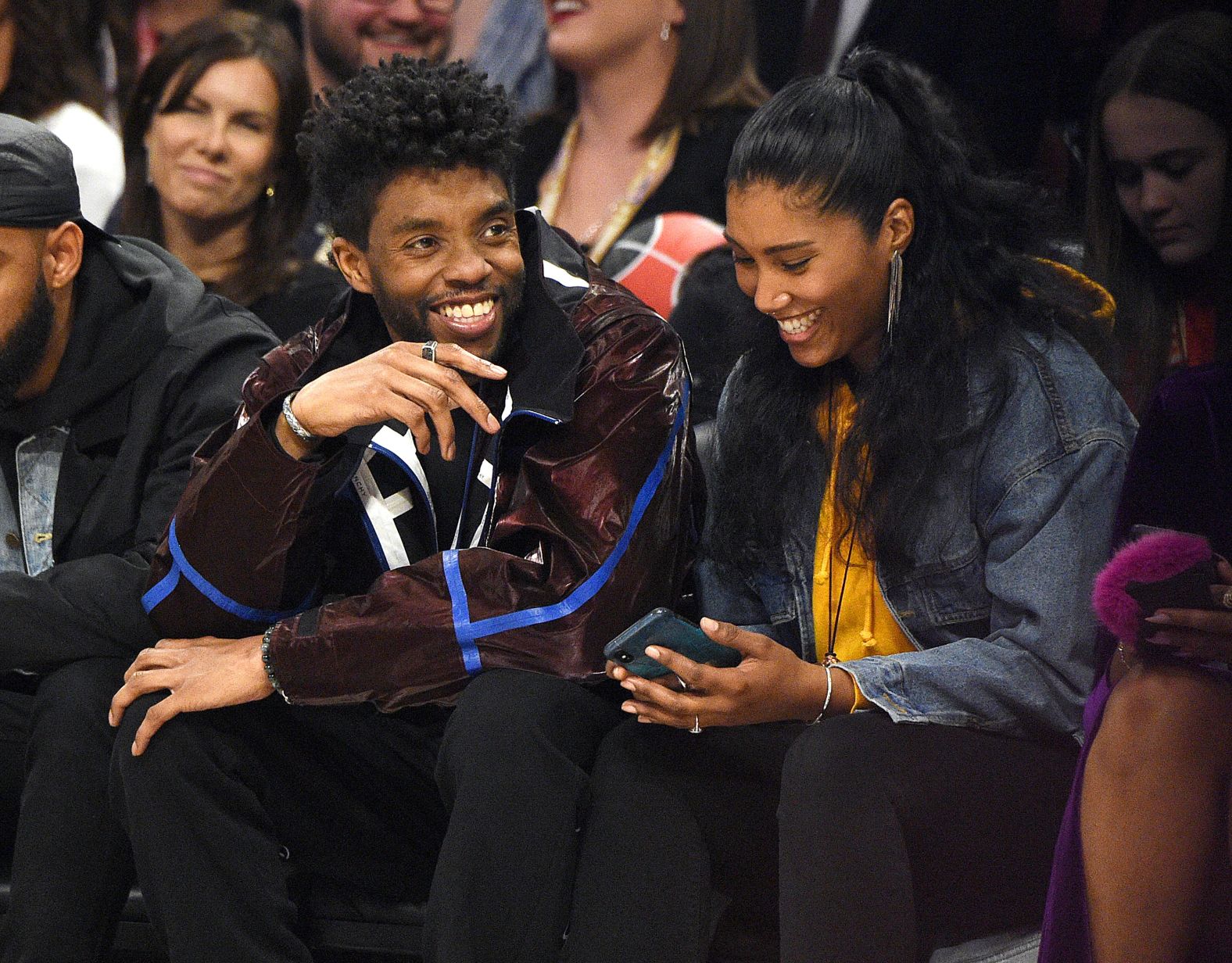 Boseman and his wife, Taylor Simone Ledward, attend the NBA All-Star Game in February 2020.