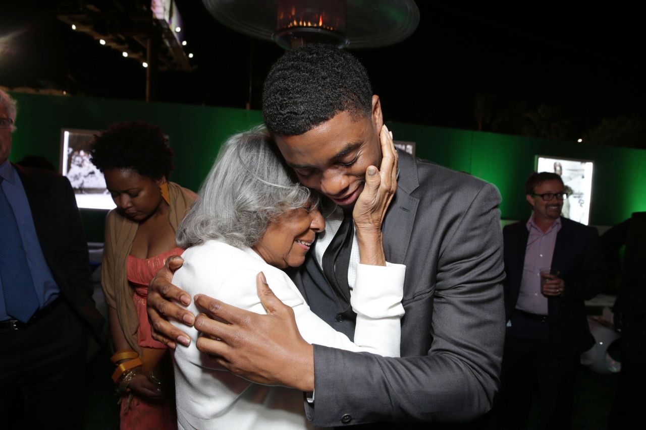 Boseman embraces Jackie Robinson's widow, Rachel, after the Los Angeles premiere of "42."