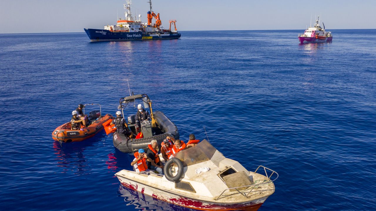 The pink rescue boat "Louise Michel" (back right) is pictured off the Libyan coast on August 22, 2020. 
