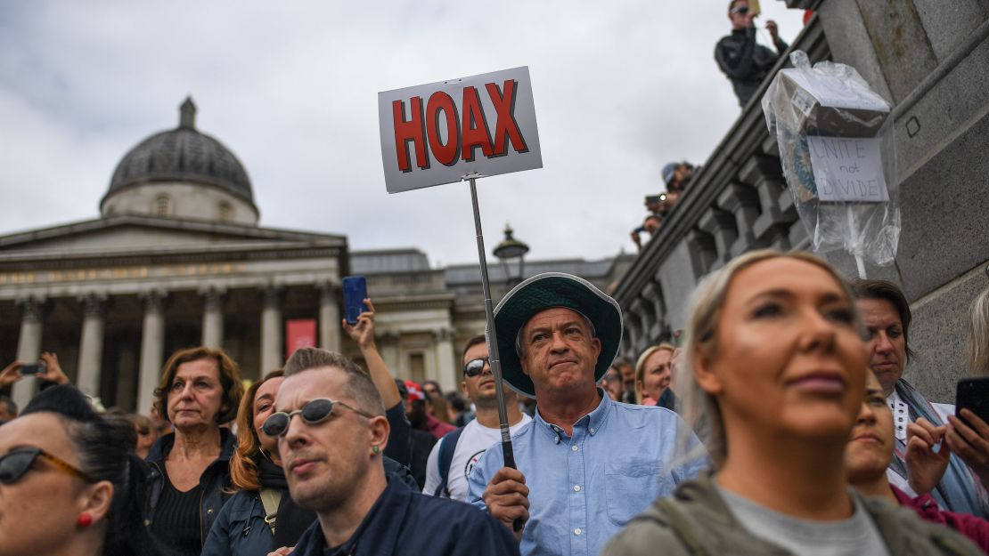 Protesters listen to speeches in Trafalgar Square during an anti-mask demo.