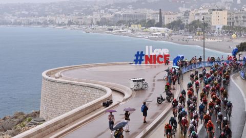 The Tour de France peloton competes on rain soaked roads in Nice at the start of the 107th Tour de France on a stage littered with crashes in treacherous conditions.