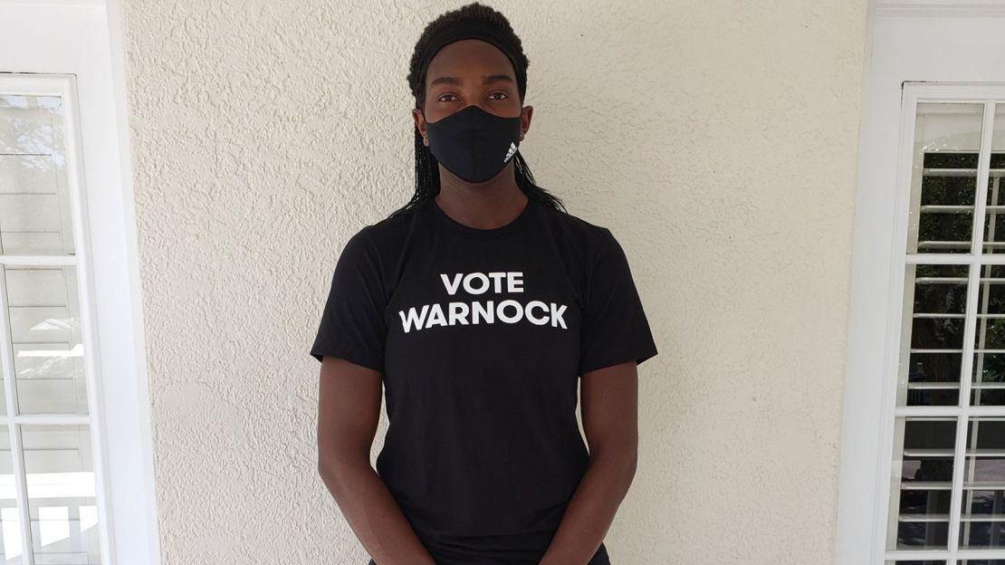 Elizabeth Williams wearing a "Vote Warnock" shirt. Many members of the Atlanta Dream, as well as players from other teams, have worn the shirts to support Raphael Warnock's US Senate campaign in Georgia.