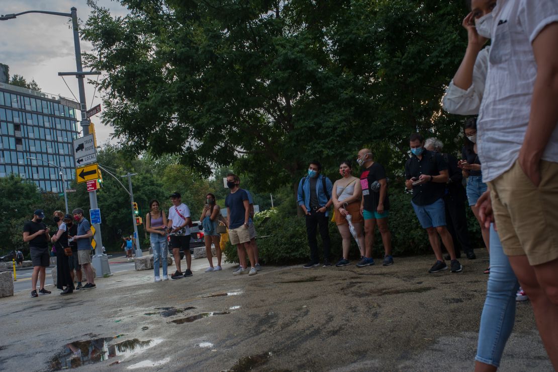 A crowd gathers at Friday's Philharmonic performance in Brooklyn Bridge Park. Performances are kept short to minimize crowd size and promote social distancing.