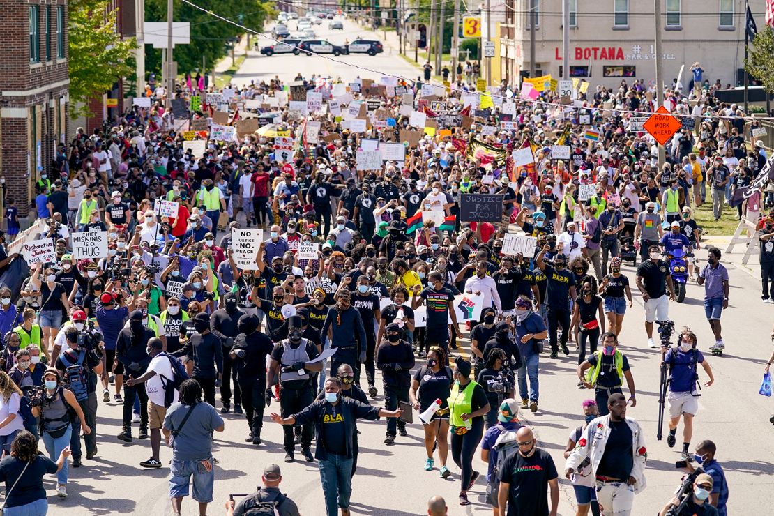 Demonstrators and local officials joined Jacob Blake's family in a march and rally in Kenosha, Wisconsin on Saturday. 