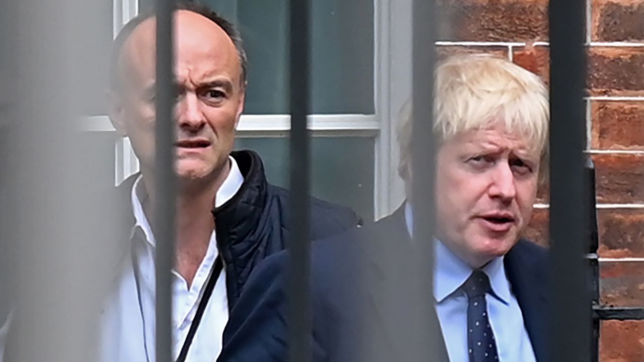 Britain's Prime Minister Boris Johnson (R) and his special advisor Dominic Cummings leave from the rear of Downing Street in central London on September 3, 2019, before heading to the Houses of Parliament. - The fate of Brexit hung in the balance on Tuesday as parliament prepared for an explosive showdown with Prime Minister Boris Johnson that could end in a snap election. Members of Johnson's own Conservative party are preparing to join opposition lawmakers in a vote to try to force a delay to Britain's exit from the European Union if he cannot secure a divorce deal with Brussels in the next few weeks. (Photo by DANIEL LEAL-OLIVAS / AFP) (Photo by DANIEL LEAL-OLIVAS/AFP via Getty Images)