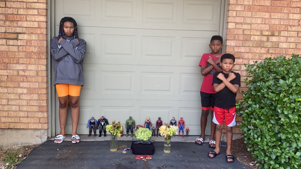 Kian and his siblings strike "Wakanda Forever" poses during a memorial for Chadwick Boseman.