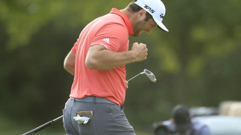 Rahm celebrates his 66-foot putt to defeat Johnson and win the BMW Championship. 