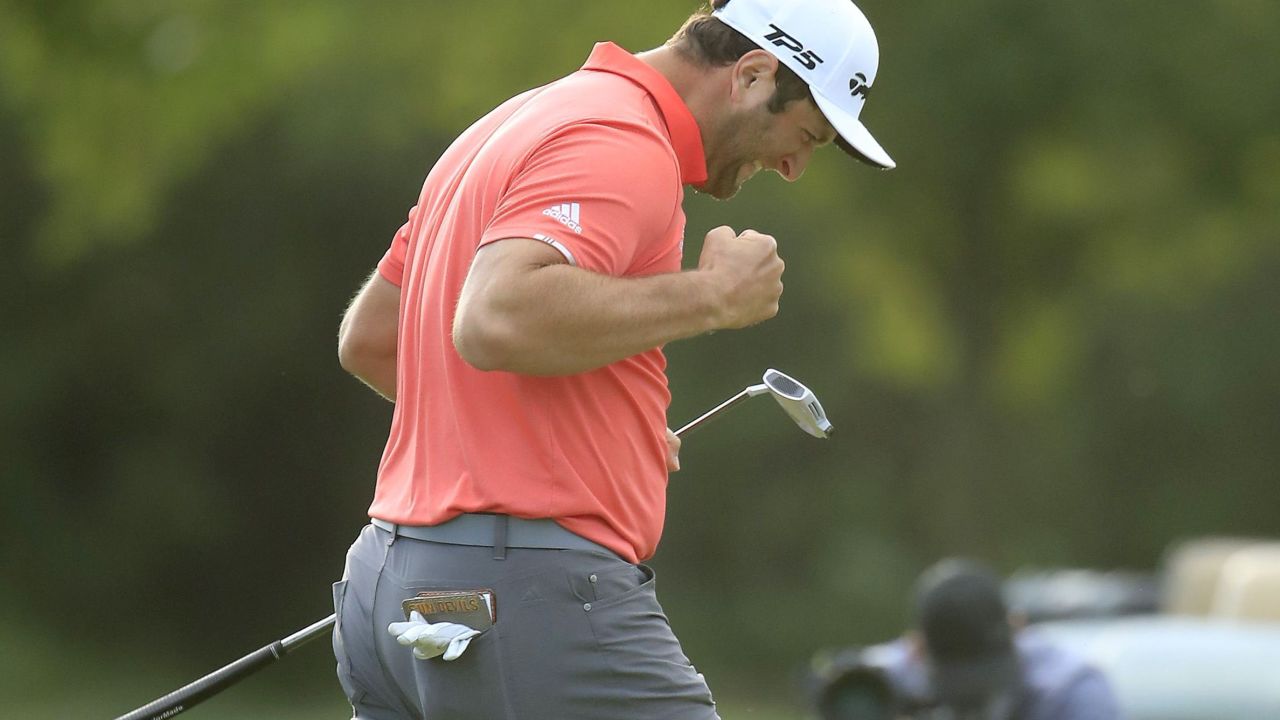 Rahm celebrates his 66-foot putt to defeat Johnson and win the BMW Championship.