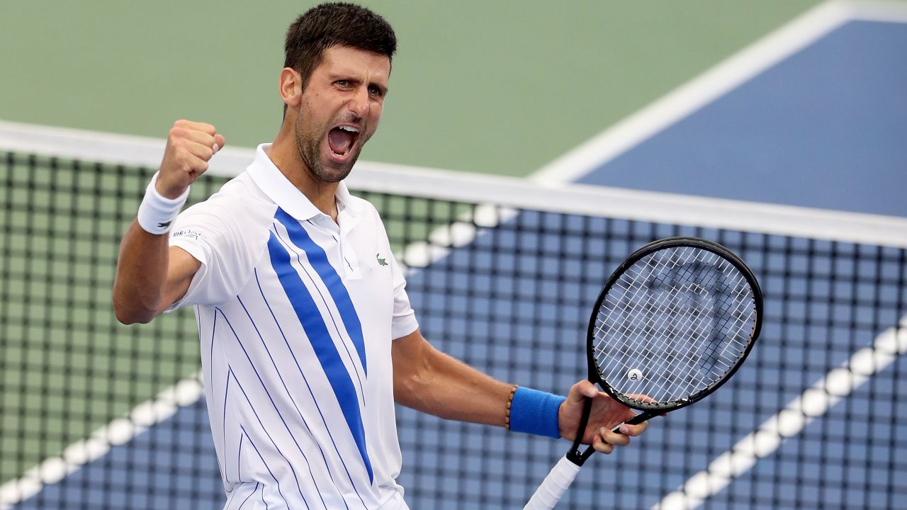 Djokovic celebrates defeating Milos Raonic in the final of the Western & Southern Open.