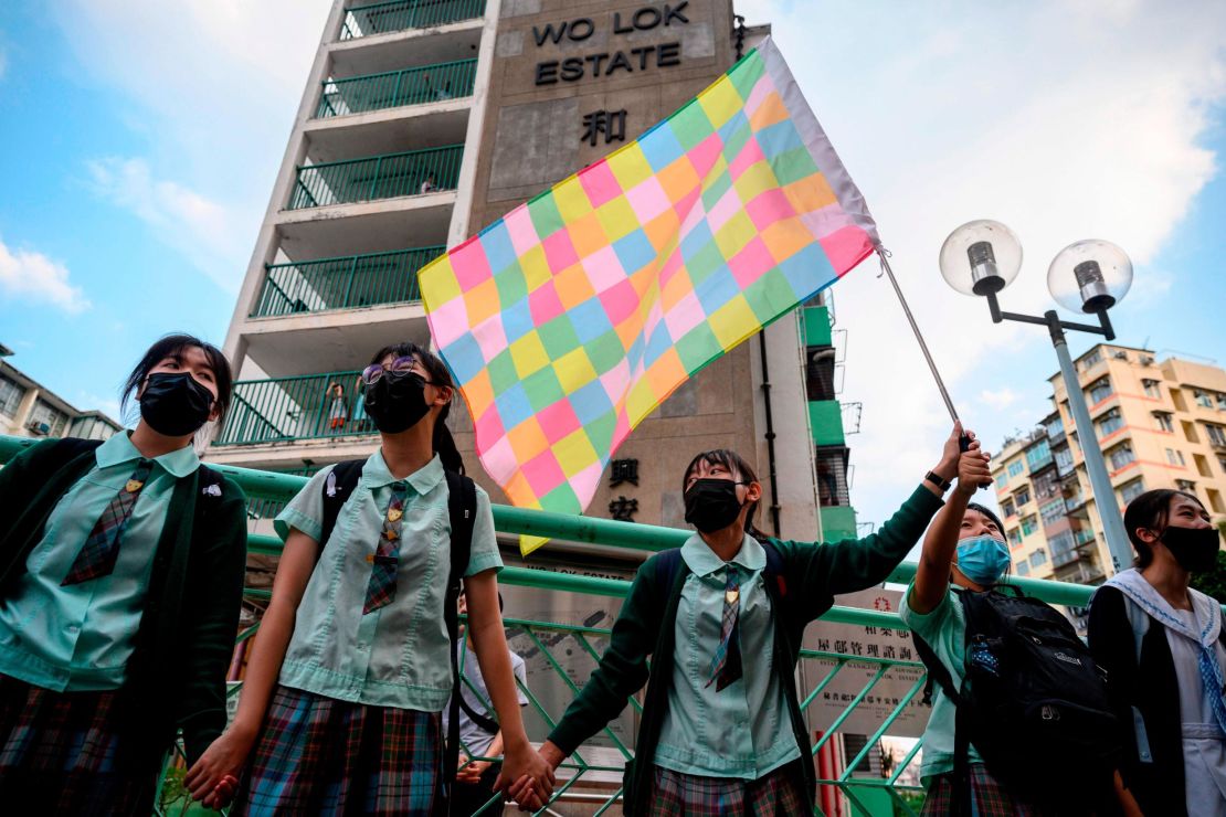 High school students join hands to form a protest chain in the Kwun Tong area of Kowloon in Hong Kong on September 24, 2019.