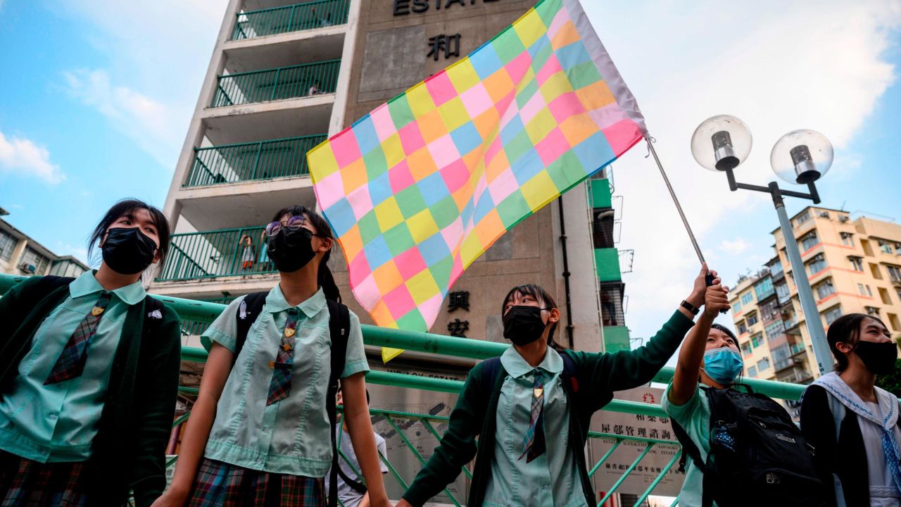 High school students join hands to form a protest chain in the Kwun Tong area of Kowloon in Hong Kong on September 24, 2019.