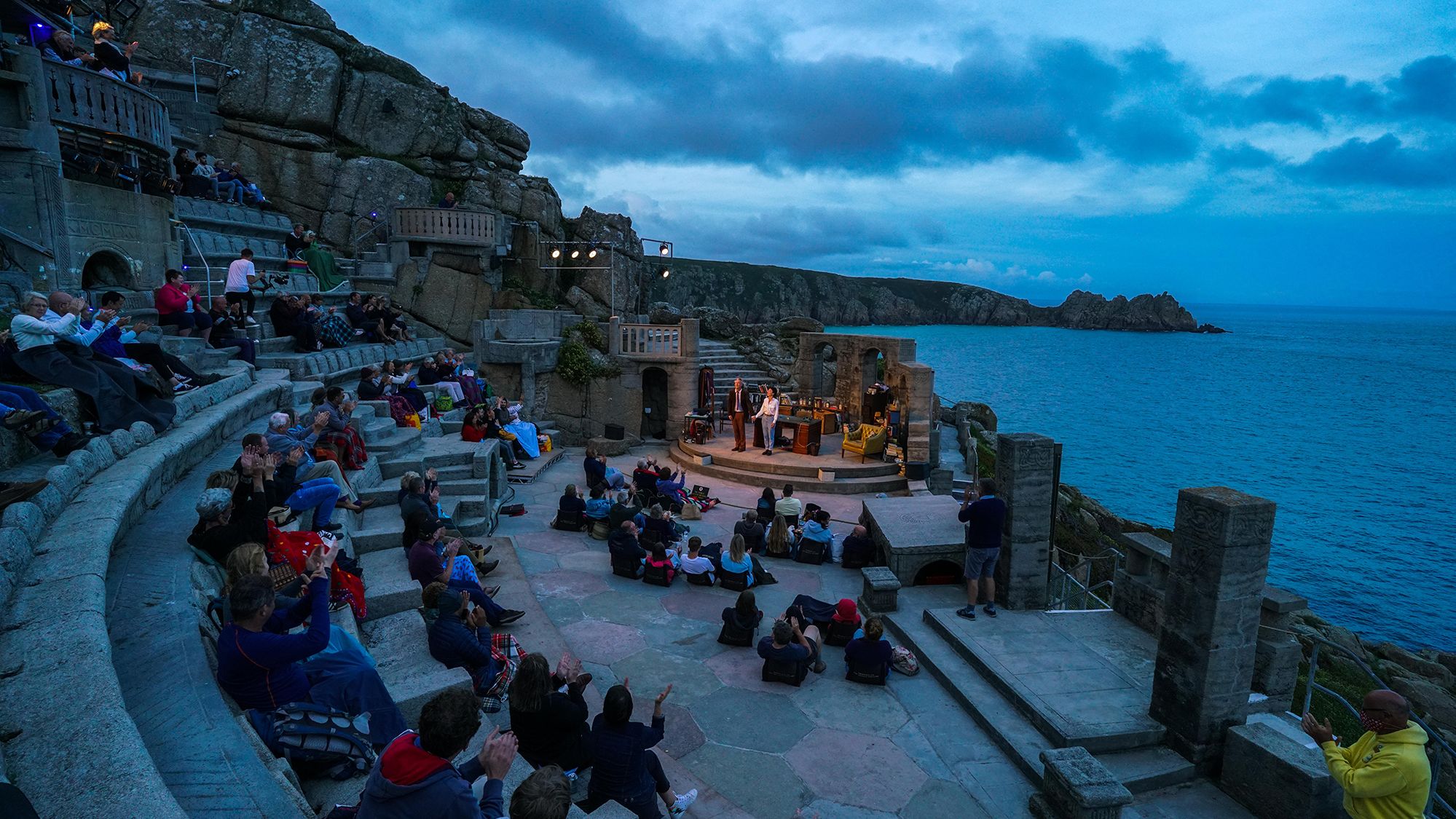 Actors Jessica Johnson and Stephen Tompkinson perform at the Minack Theatre in Porthcurno, England, during a production of Willy Russell's "Educating Rita" on August 18.