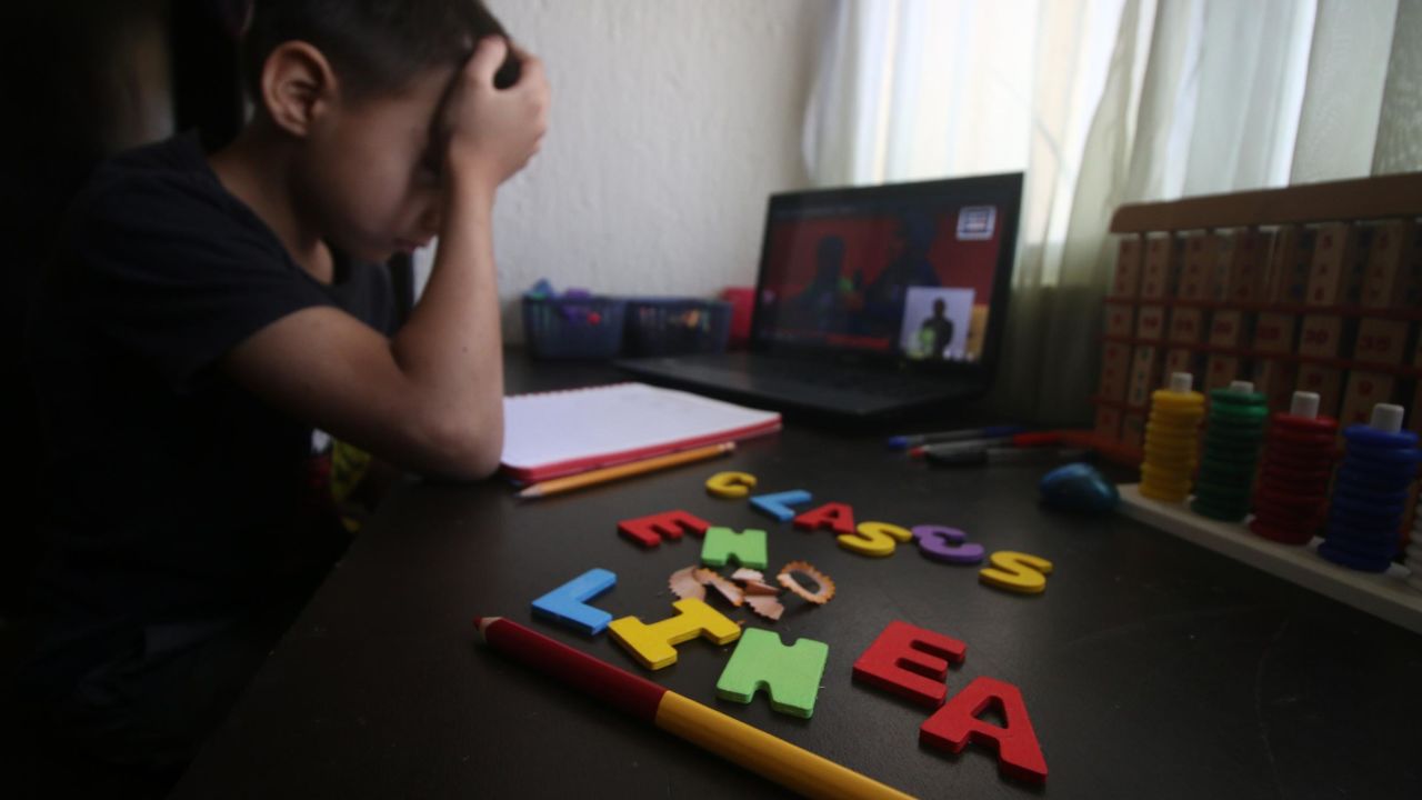 CANCUN, MEXICO - AUGUST 24: Student reacts during the start of the school year from home on August 24, 2020 in Cancun, Mexico. Mexican government will not allow in-person lessons this year and has developed a remote education system based on TV broadcasting. "Aprende en Casa" ("learn at home") program will support around 30 million students in the country in the 4 levels of basic education (kindergarten, preschool, elementary and secondary school) during the Covid-19 pandemic. Books will be available in an online platform and over 4,000 educational TV programs have been prepared to be broadcasted in different channels. According to official statistics, 56% of households have access to internet while 93% have a television. Radio programs will also be used to reach those kids with no connection nor TV, specially at indigenous communities. (Photo by Medios y Media/Getty Images)