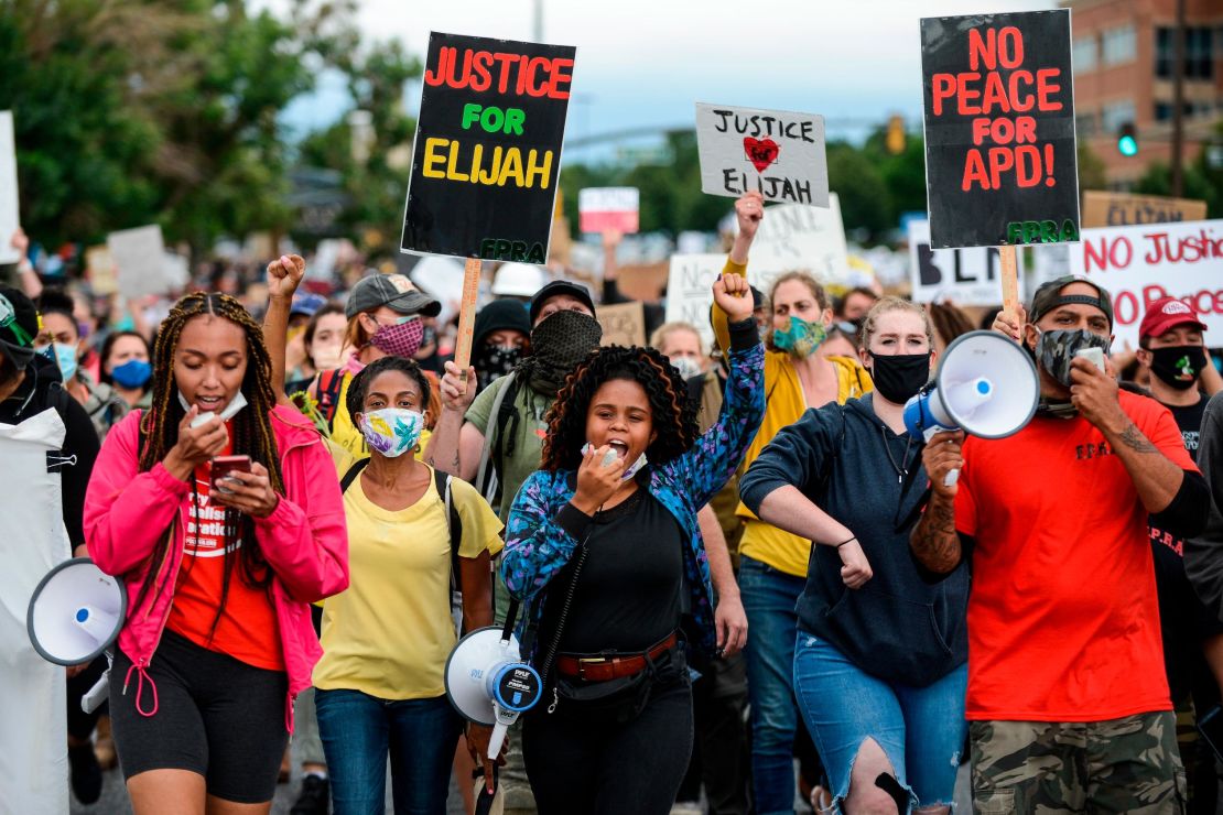 People march in the street to protest the death of Elijah McClain on July 25, 2020, in Aurora, Colorado.