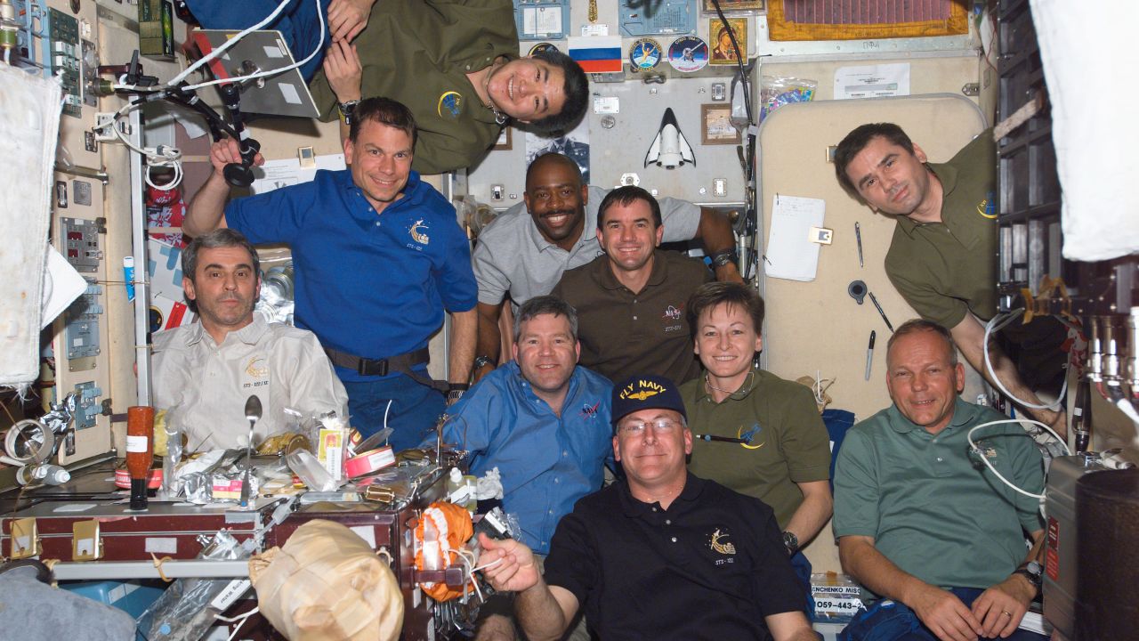 Melvin was with nine other crew members on the space station in February 2008. On the left side of the frame, from top to bottom, are astronauts Daniel Tani, Stanley Love and the European Space Agency's Leopold Eyharts. In  the center, from the top, are astronauts Leland Melvin, Rex Walheim, Steve Frick, Peggy Whitson and Alan Poindexter. Cosmonaut Yuri Malenchenko of Russia's Federal Space Agency is top right and below him is ESA astronaut Hans Schlegel. 