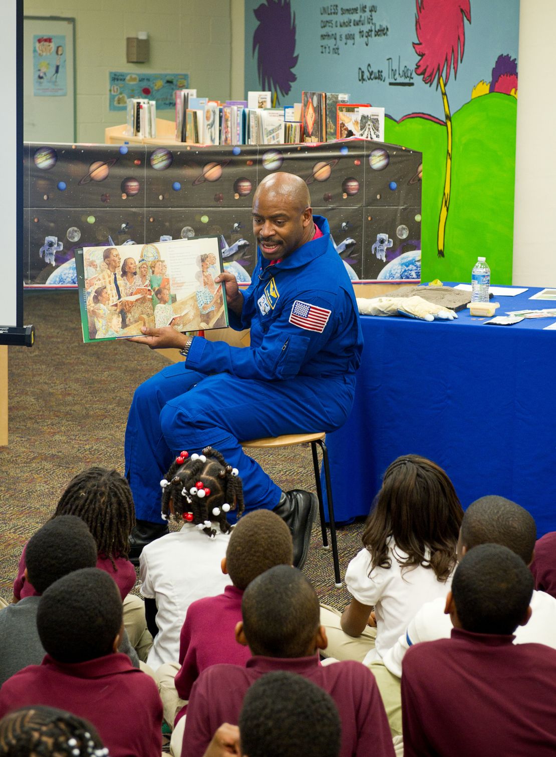 Melvin read to first and third grade students from the book "The Moon Over Star" at Ferebee-Hope Elementary School on Tuesday, Feb. 8, 2011, in honor of Black History Month, and to highlight the importance of reading.