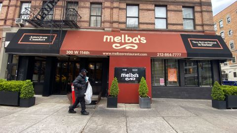 A person walks by Melba's restaurant in Harlem during the coronavirus pandemic on April 23, 2020 in New York City. 