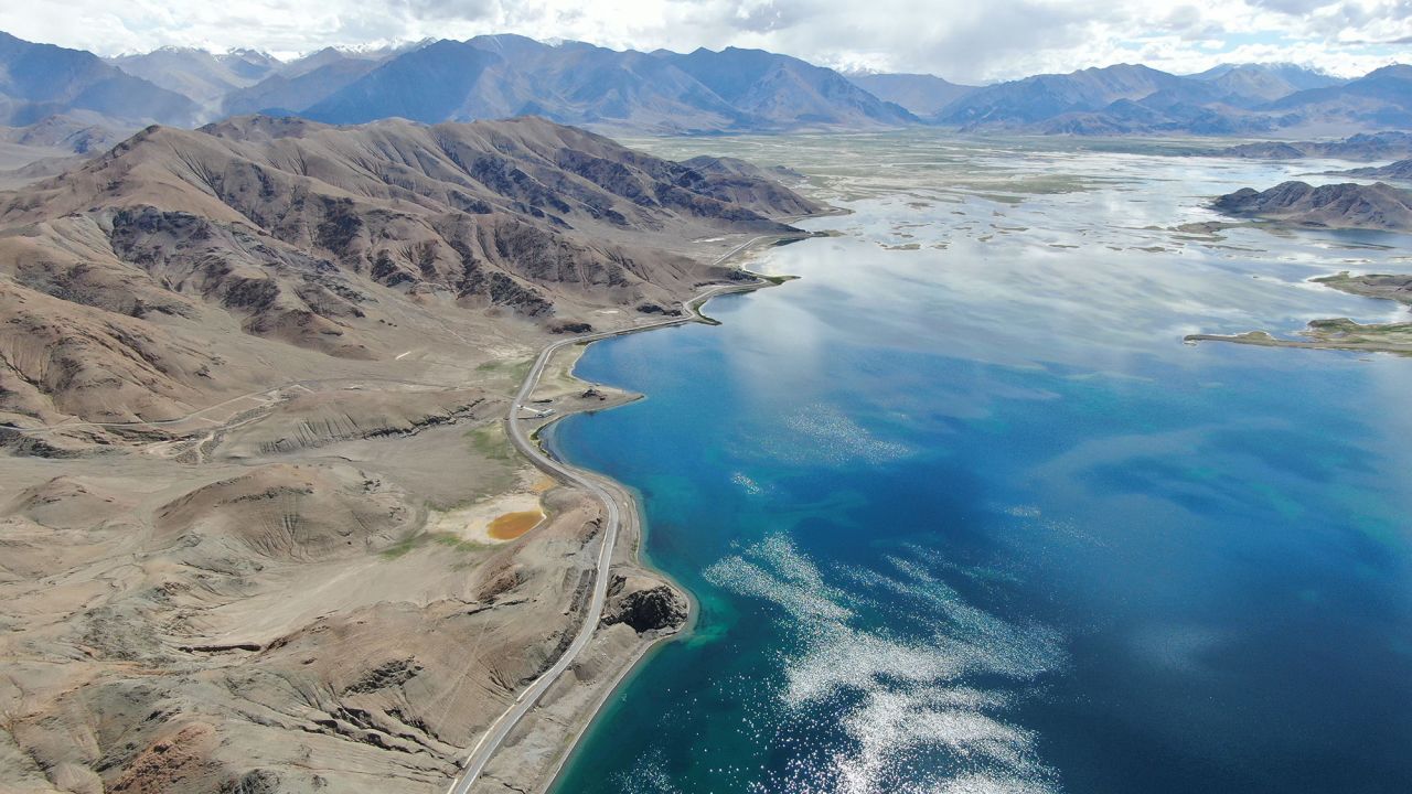 An Aerial photo taken on August 3, 2019 shows a road along the Pangong Tso lake in southwest China's Tibet Autonomous Region. 