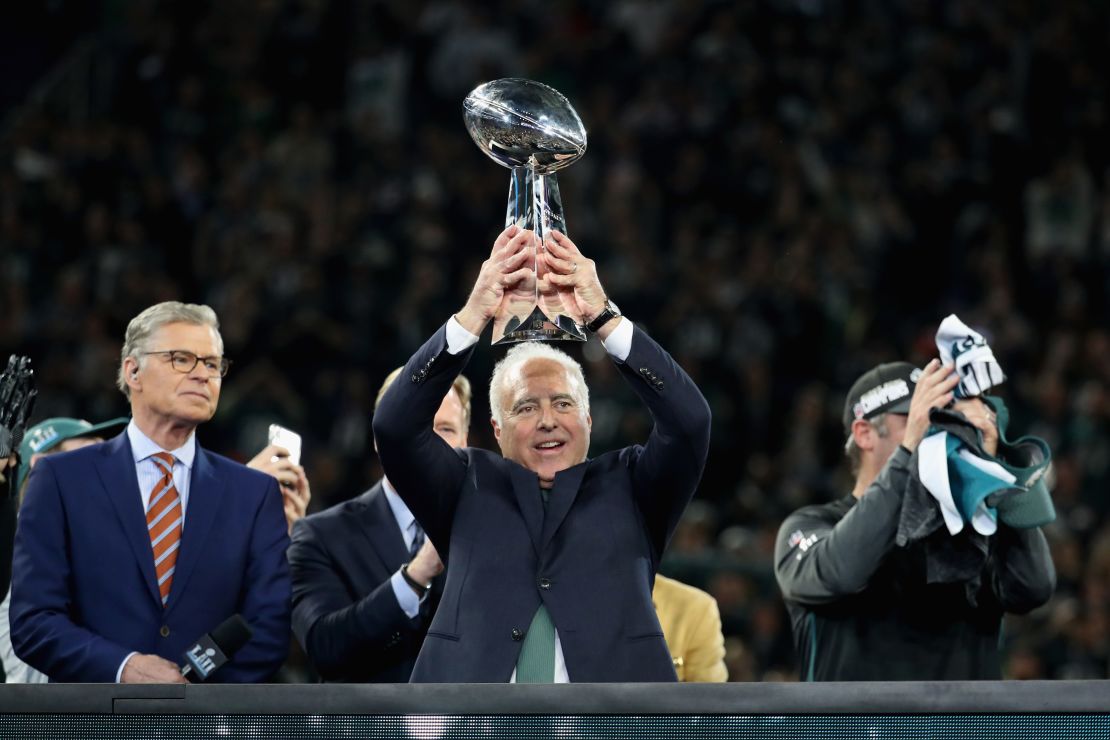 Lurie holds up the Vince Lombardi Trophy after his teams 41-33 victory over the New England Patriots.