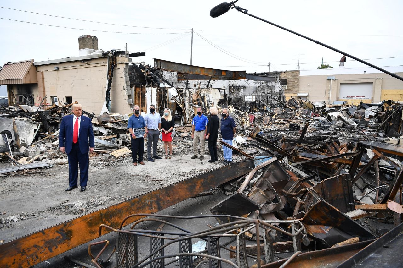 Trump tours a building that was damaged during the protests in Kenosha.