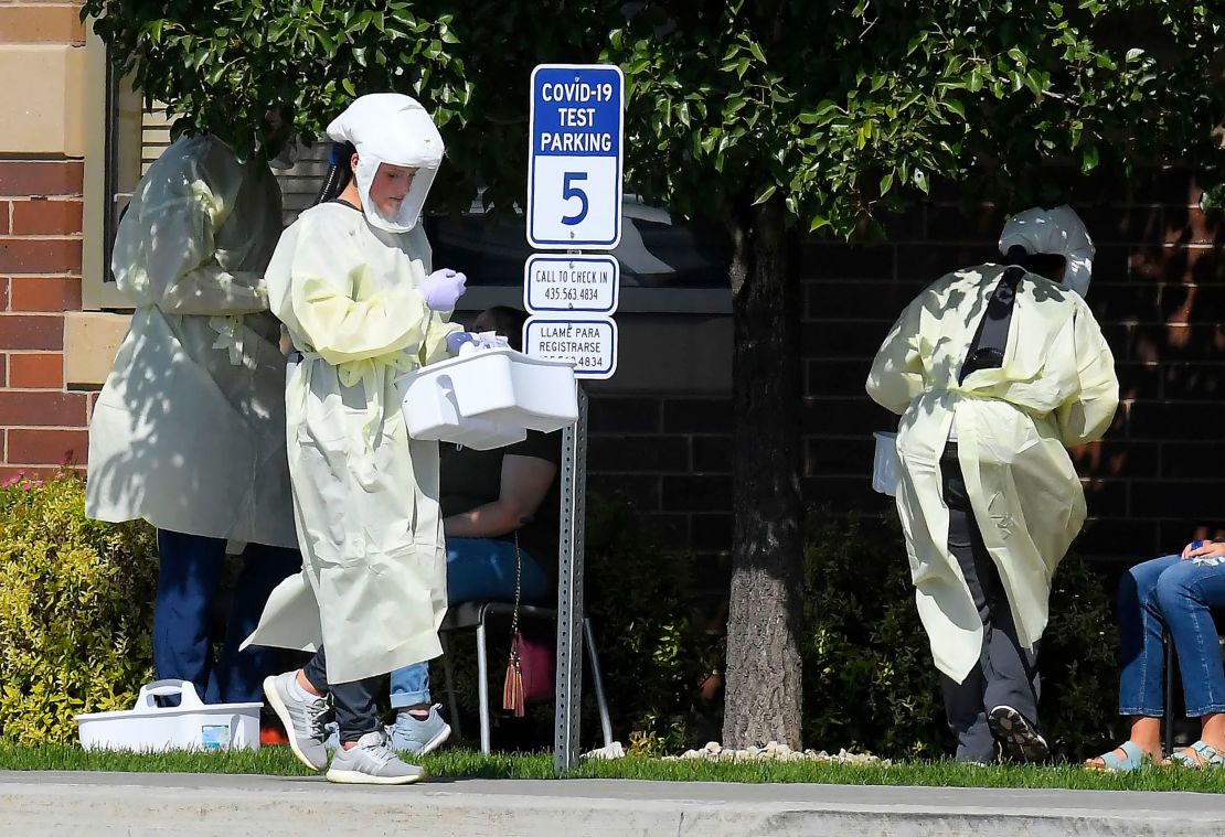 Workers test Utah State University students for Covid-19 on Sunday, August 30.