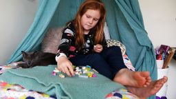 AUCKLAND, NEW ZEALAND - APRIL 15: Nina Goodall (8) works on a lesson in contraction words using Lego her mum made after seeing an example online on the first day of term while in lockdown at her home in Kaipara Flats on April 15, 2020 in Auckland, New Zealand. Students across New Zealand are returning to school online for the start of Term 2 with students of all levels learning from home.New Zealand has been in lockdown since Thursday 26 March following tough restrictions imposed by the government to stop the spread of COVID-19 across the country.  A State of National Emergency is in place along with an Epidemic Notice to help ensure the continuity of essential Government business. Under the COVID-19 Alert Level Four measures, all non-essential businesses are closed, including bars, restaurants, cinemas and playgrounds. Schools are closed and all indoor and outdoor events are banned. Essential services will remain open, including supermarkets and pharmacies. Lockdown measures are expected to remain in place for around four weeks, with Prime Minister Jacinda Ardern warning there will be zero tolerance for people ignoring the restrictions, with police able to enforce them if required. (Photo by Fiona Goodall/Getty Images)
