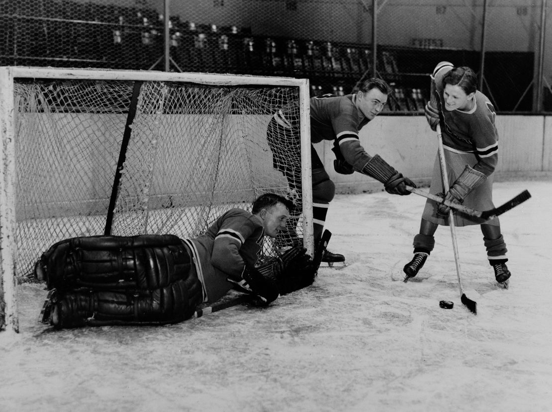 Didrikson (right) works out with the New York Rangers players Murray Murdock (center) and Andy Aitkenhead, goalie, in Madison Square Garden in New York City in 1933.