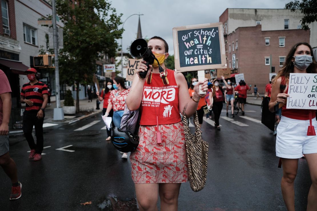 Teachers, along with parents and students, marched through Brooklyn to demand a safer school environment. 