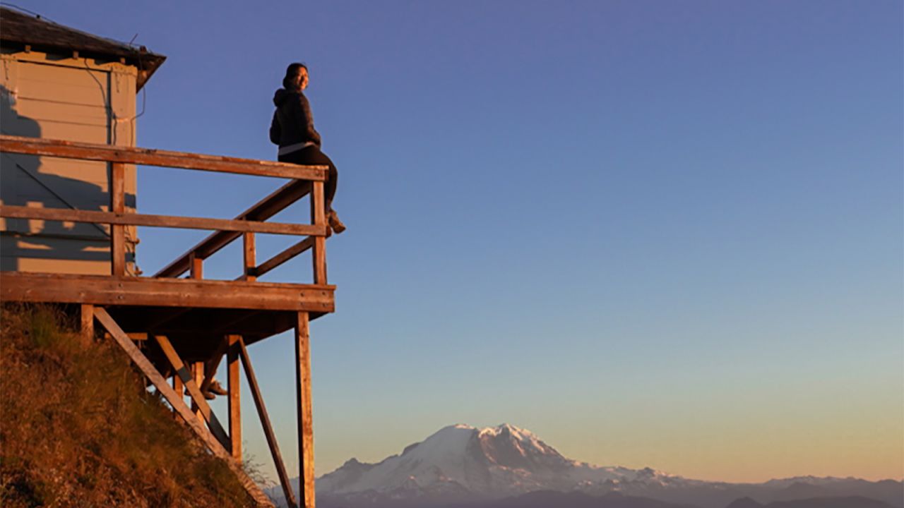 <strong>Emily Cheng: </strong>Cheng loves traveling for work but admits it can be lonely and isolating at times. Here she is overlooking a gorgeous mountaineous view in Mount Tahoma, Washington.