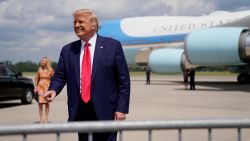 With Air Force One in the background, President Donald Trump arrives at Wilmington International Airport, Wednesday, Sept. 2, 2020, in Wilmington, N.C. (AP Photo/Evan Vucci)