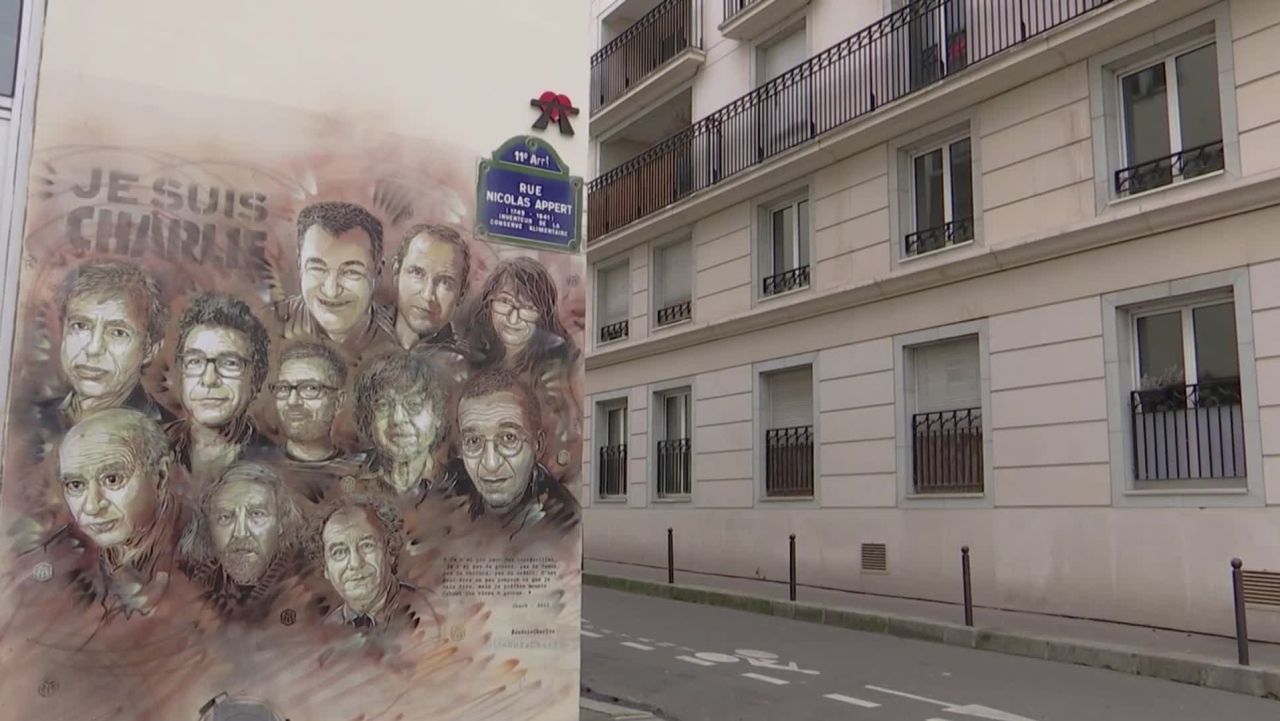A mural of Charlie Hebdo employees killed in the attack on the satirical magazine in January 2015.