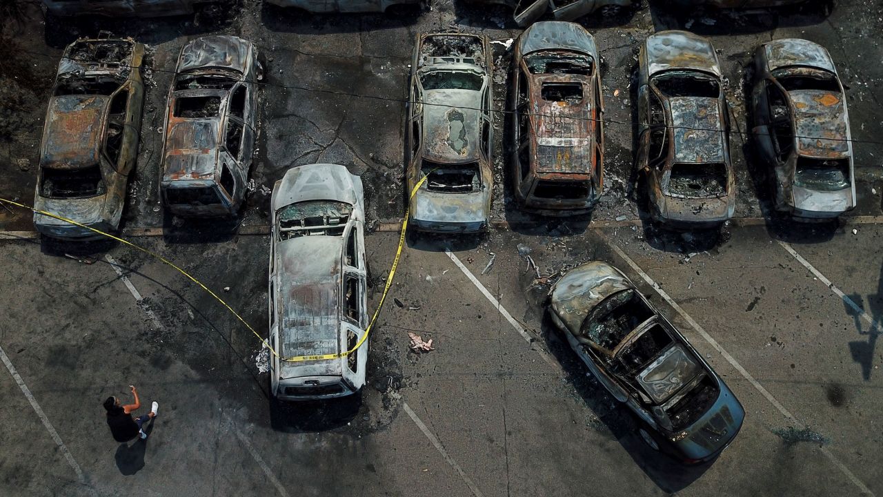 Burned out vehicles are seen August 24 in Kenosha. Many of the cars were set on fire during protests the night before. 