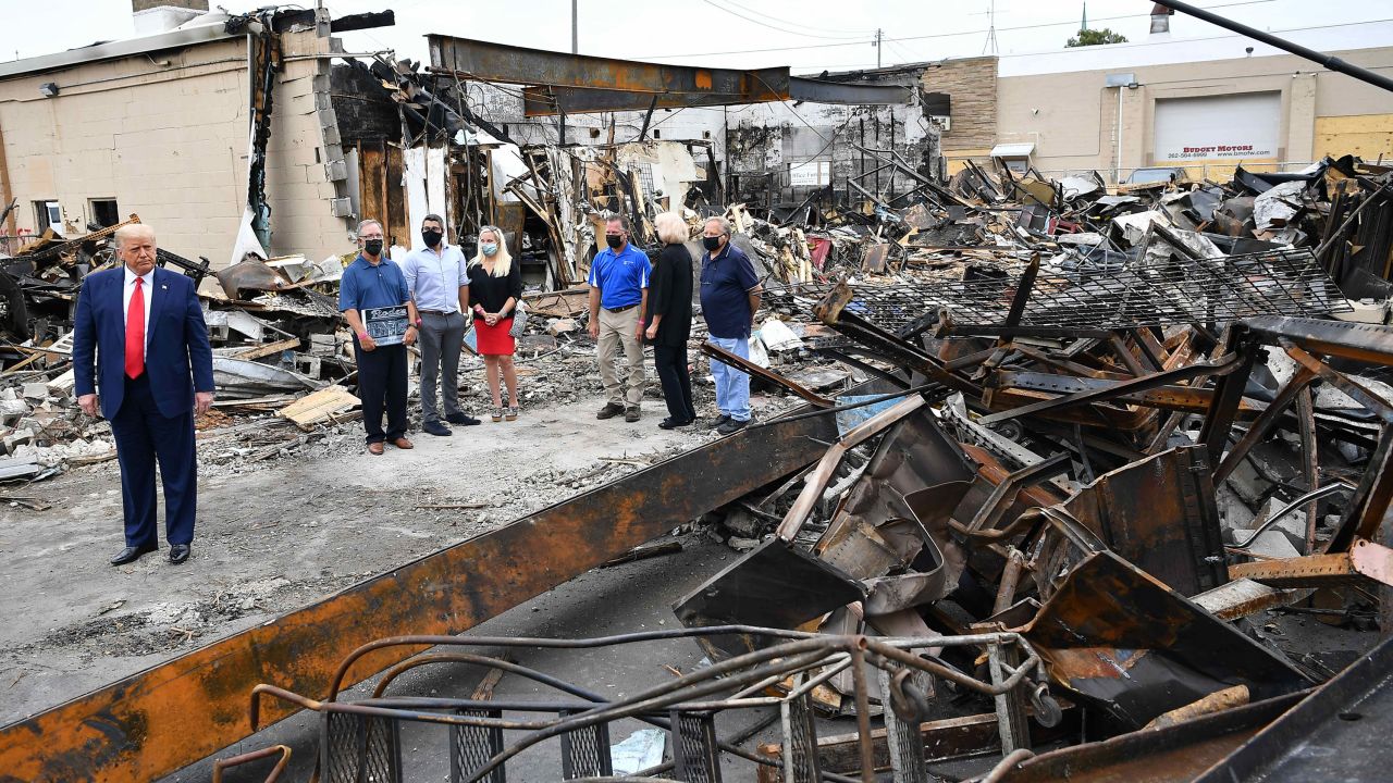 President Donald Trump tours an area affected by civil unrest in Kenosha on September 1.