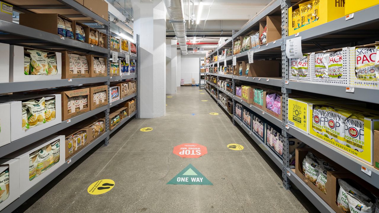 Whole Foods' new online-only store allows workers inside to pick items off shelves and deliver them to customers in the Brooklyn area. 