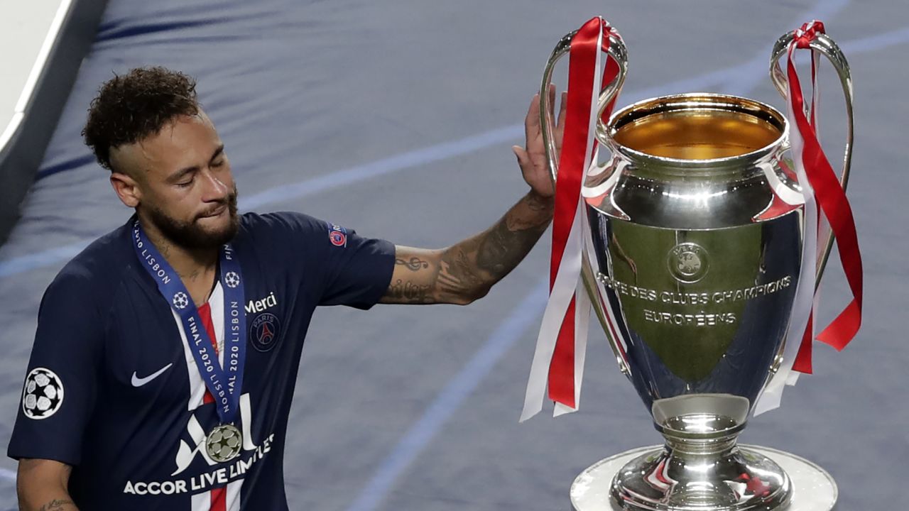 Neymar touches the Champions League trophy after losing in the final to Bayern Munich.