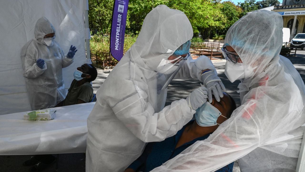 Red Cross staff take samples from a woman during a Covid-19 screening campaign in Montpellier, southern France, on September 3.