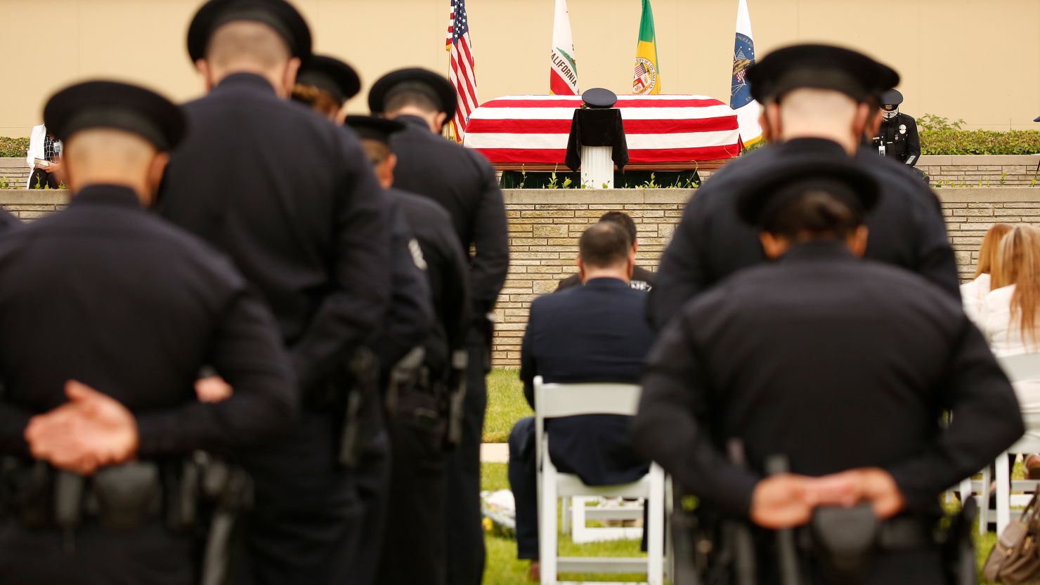 Los Angeles Police Department officers, family and friends attend the funeral of Officer Valentin Martinez, the agency's first sworn employee to die of complications from Covid-19.
