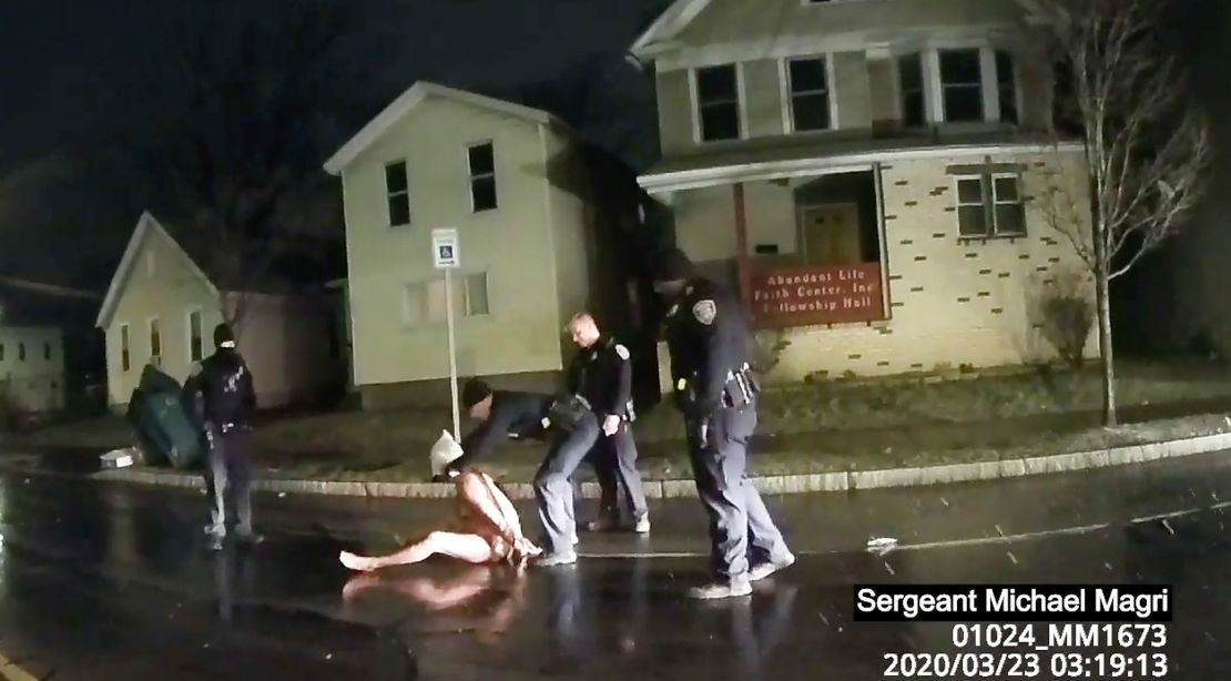 In this image taken from police body camera video provided by Roth and Roth LLP, a Rochester police officer puts a hood over the head of Daniel Prude, on March 23, 2020, in Rochester, NY.