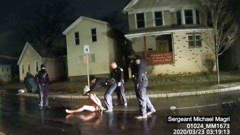In this image taken from police body camera video provided by Roth and Roth LLP, a Rochester police officer puts a hood over the head of Daniel Prude, on March 23, 2020, in Rochester, New York.