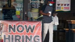 FILE - In this Sept. 2, 2020, file photo, a customer walks past a now hiring sign at an eatery in Richardson, Texas. The Labor Department reported unemployment numbers Thursday, Sept. 3. (AP Photo/LM Otero, File)