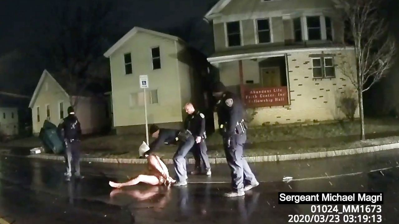 In this image taken from police body camera video provided by Roth and Roth LLP, a Rochester police officer puts a hood over the head of Daniel Prude on March 23 in Rochester, New York.