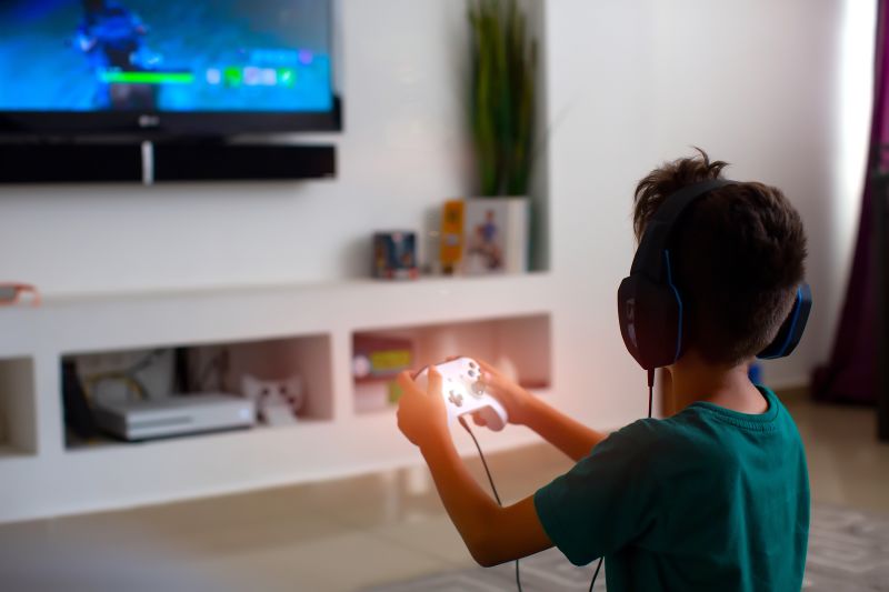 Child playing hot sale video games