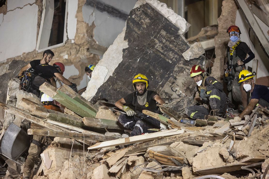 Rescue workers clear rubble from a destroyed building with the aim of finding a potential survivor in the aftermath of the Beirut blast.