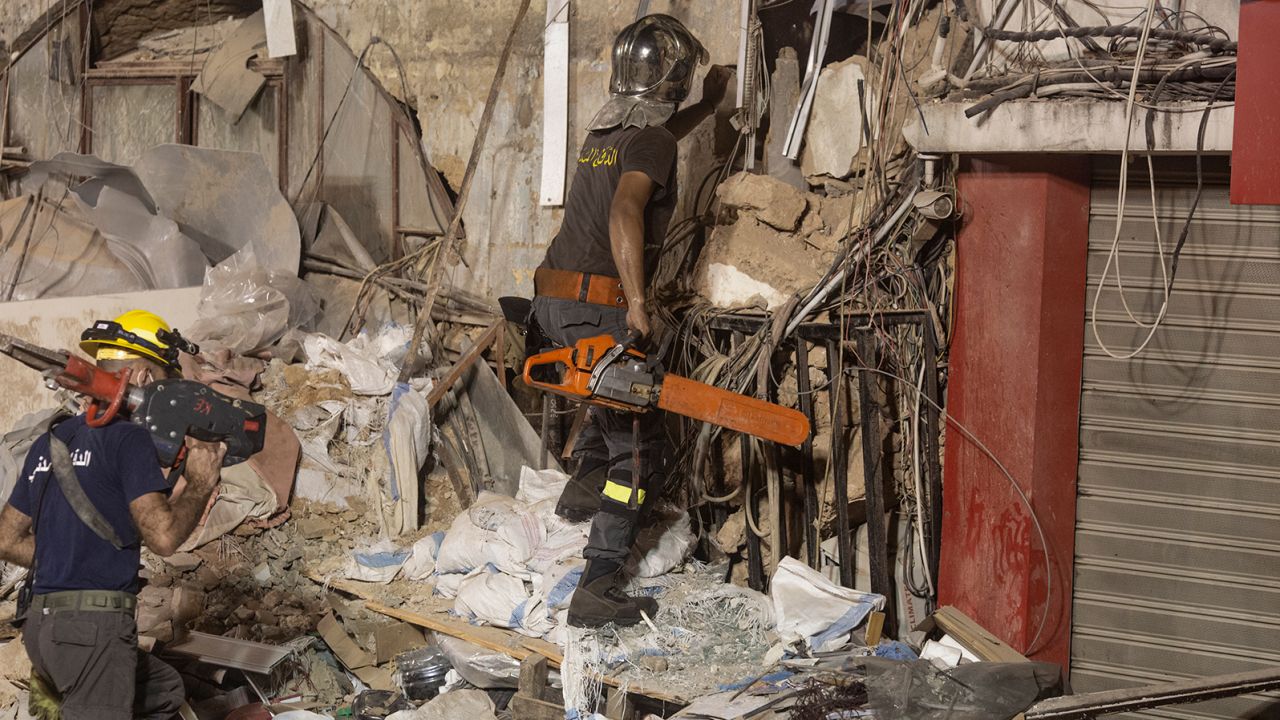 Rescue workers return to search a destroyed building with the aim of finding a potential survivor in the aftermath of the Beirut blast on September 4, 2020 in Beirut, Lebanon. 