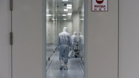 Employees walk on May 20 in a passage at the headquarters of Russia's biotech company BIOCAD, which has been working on a vaccine against the coronavirus.