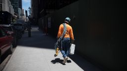 A construction worker carries tools at a construction site in New York, U.S., on Monday, June 8, 2020. Only 1.2% of New Yorkers tested Sunday were infected with the new coronavirus, the lowest rate since the pandemic began. "Why are we reopening? Because these numbers say we can," Governor Andrew Cuomo said said at a news conference in Manhattan. Photographer: Michael Nagle/Bloomberg via Getty Images