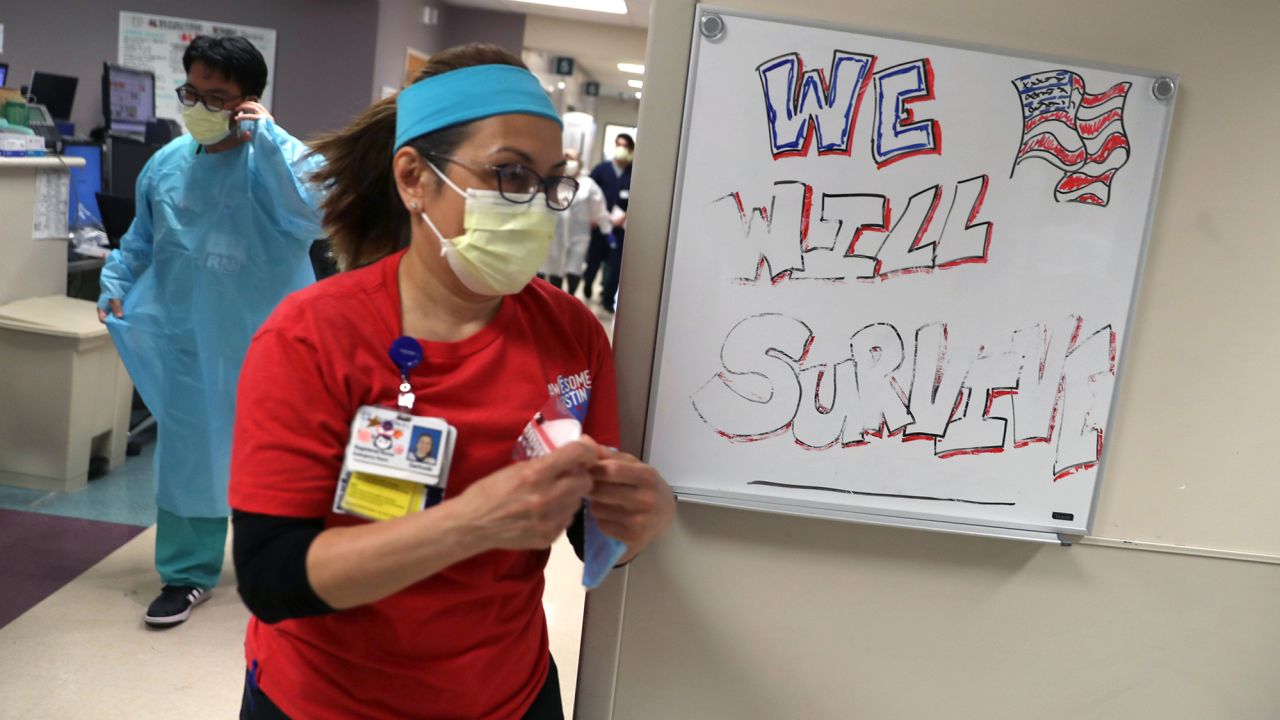 Nurse rushes to patient being admitted to Regional Medical Center in San Jose, California, in May.