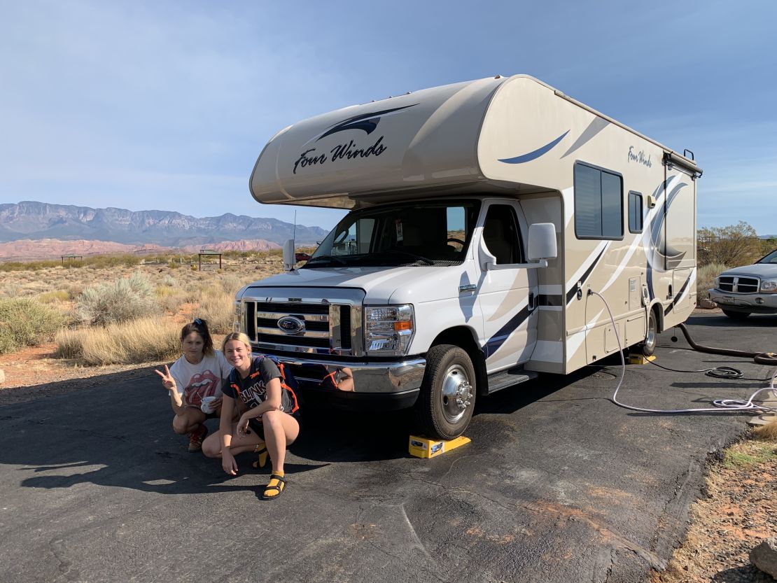 The author's daughters Shannon, right, and Chelsea Yogerst pose in front of Thor in Hurricane, Utah.