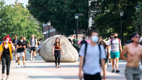 Students walk along the T. Anne Cleary Walkway during the first day of in-person classes for the fall semester on Monday, Aug. 24, 2020.