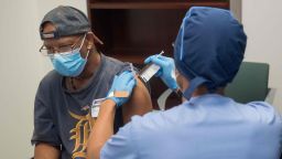 In this image courtesy of the Henry Ford Health System, volunteers are given the Moderna mRNA-1273 Coronavirus Efficacy (COVE), on August 5, 2020, in Detroit, Michigan.  (Photo by -/Henry Ford Health System/AFP via Getty Images)